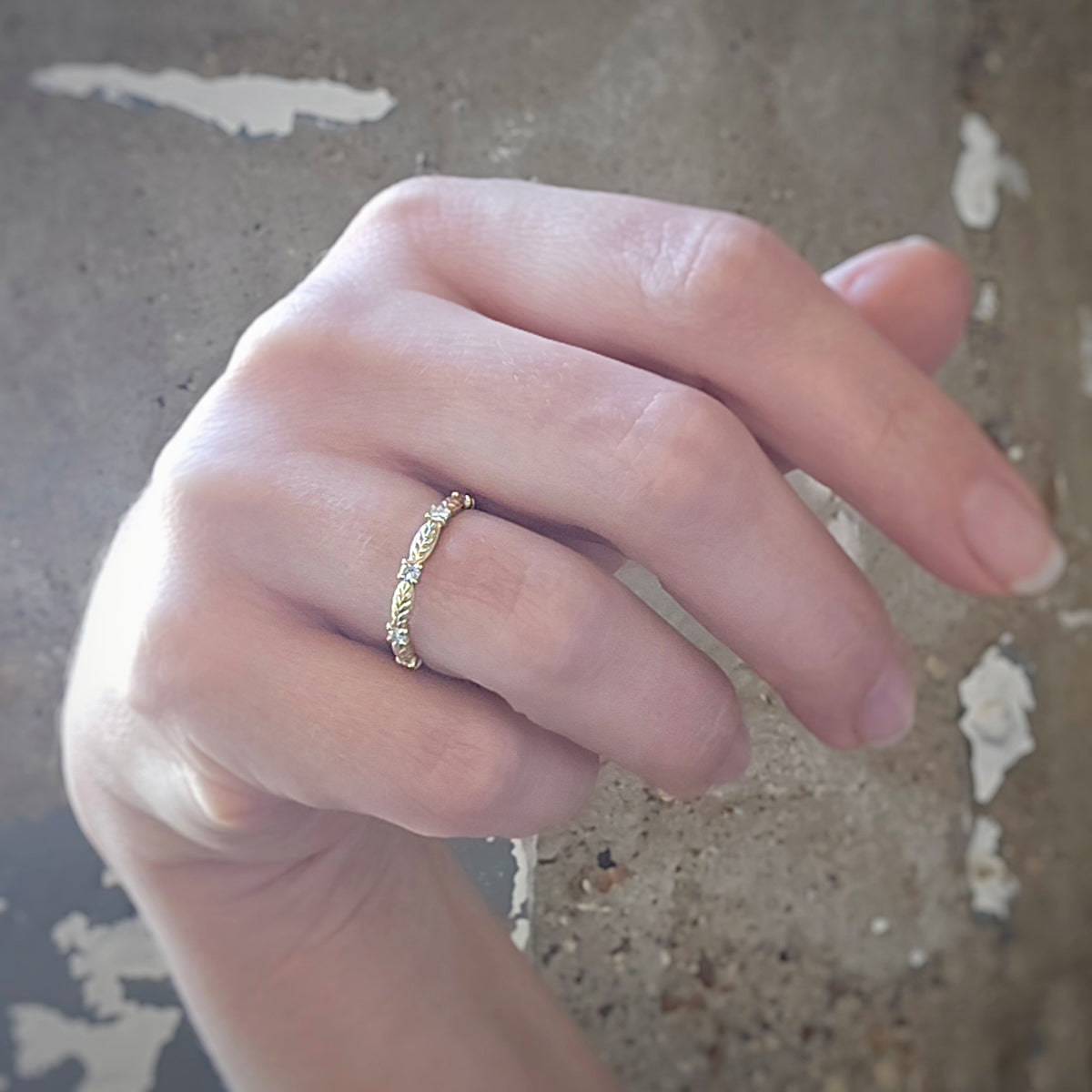 Hand carved 18K yellow gold eternity band with single cut diamonds