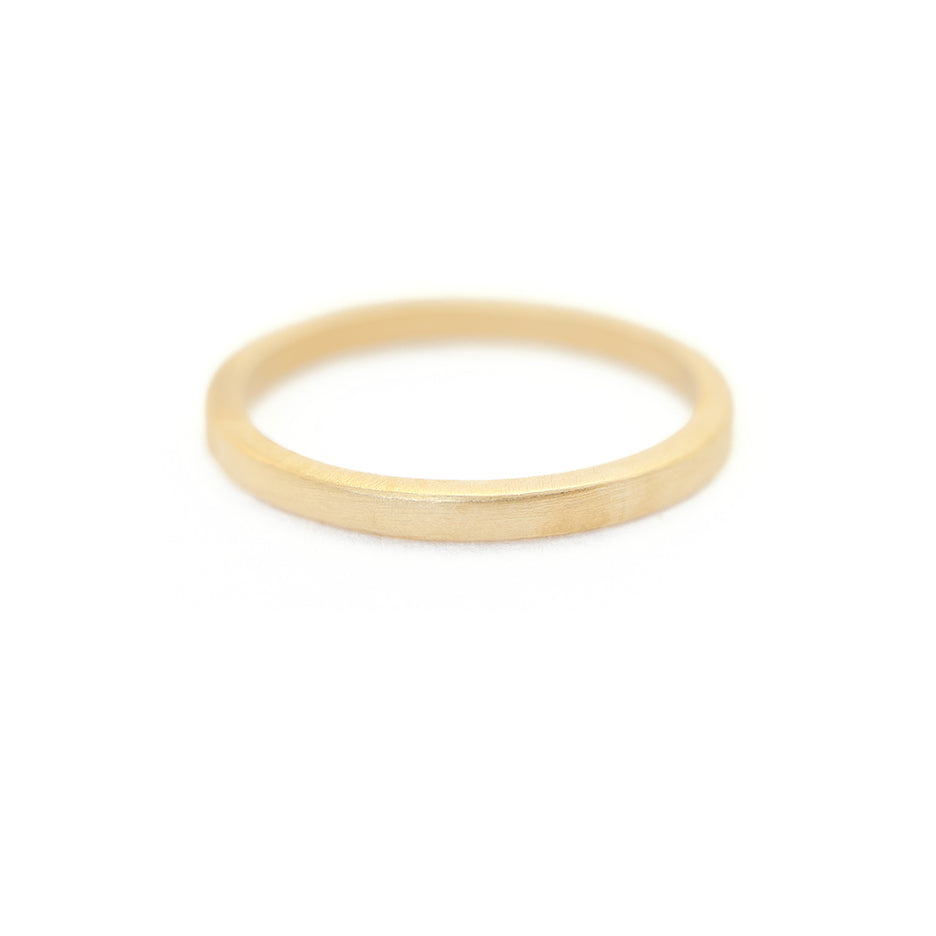 Handmade classic thin plain stacking or wedding band in 18K yellow gold by Designer Megan Thorne