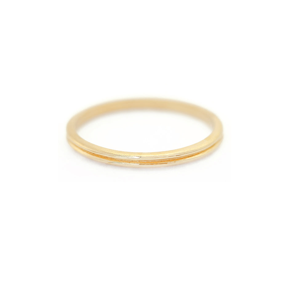 Handmade plain thin wedding band or stacking band with ione detail in 18K yellow gold by Designer Megan Thorne