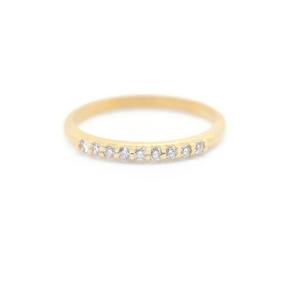 Handmade pave wedding or stacking band with diamonds and beading in 18K yellow gold by Designer Megan Thorne