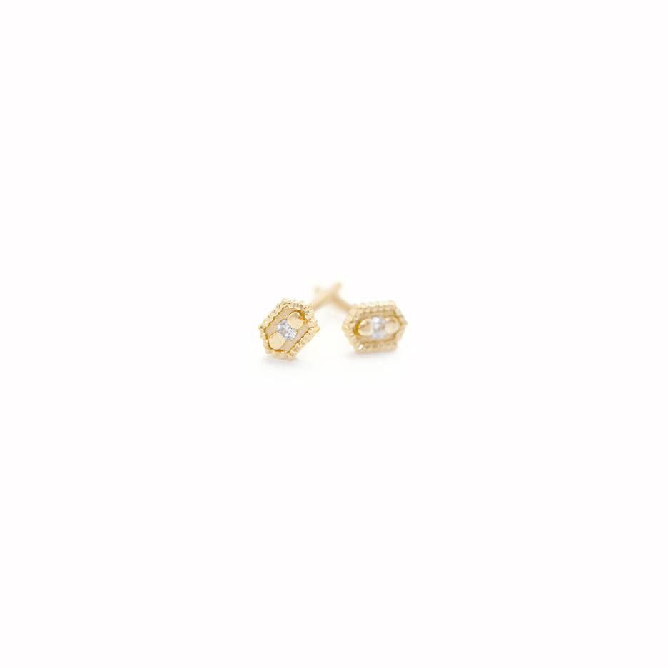 Handmade hexagon shaped stud earrings with ribbing, beading and diamonds in 18K yellow gold by Designer Megan Thorne