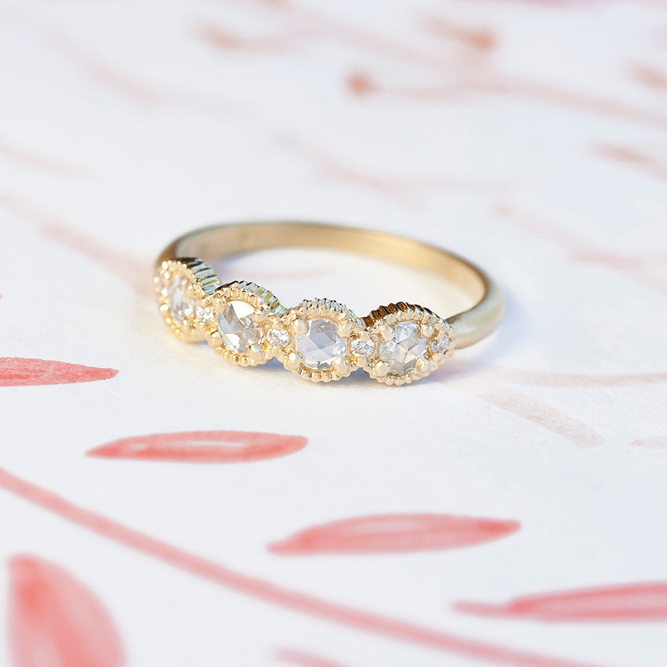 Handmade wedding or stacking band with rose cut diamonds and brilliant cut accents with ribbed details in 18K yellow gold by Designer Megan Thorne