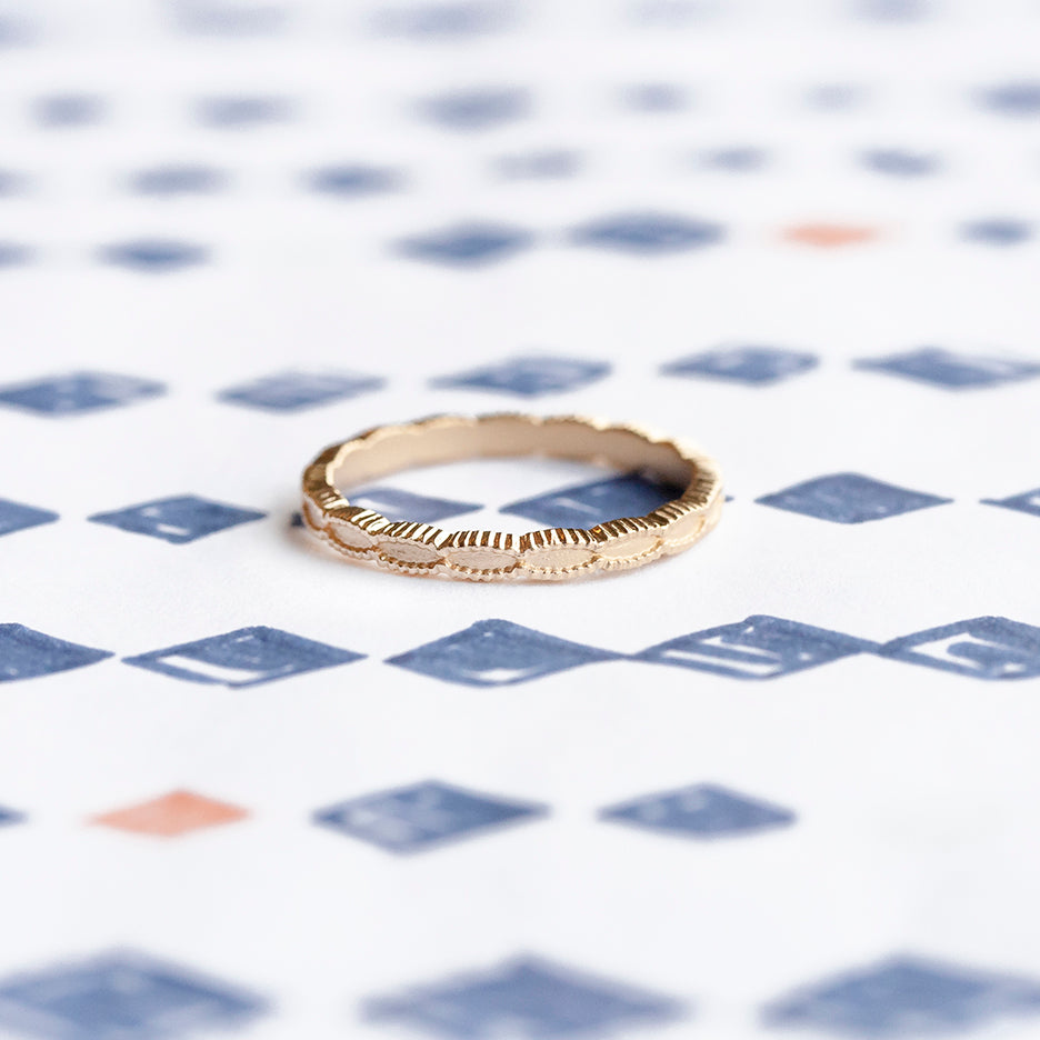 Handmade simple plain thin wedding band with scalloped ribbing in 18K yellow gold by Designer Megan Thorne