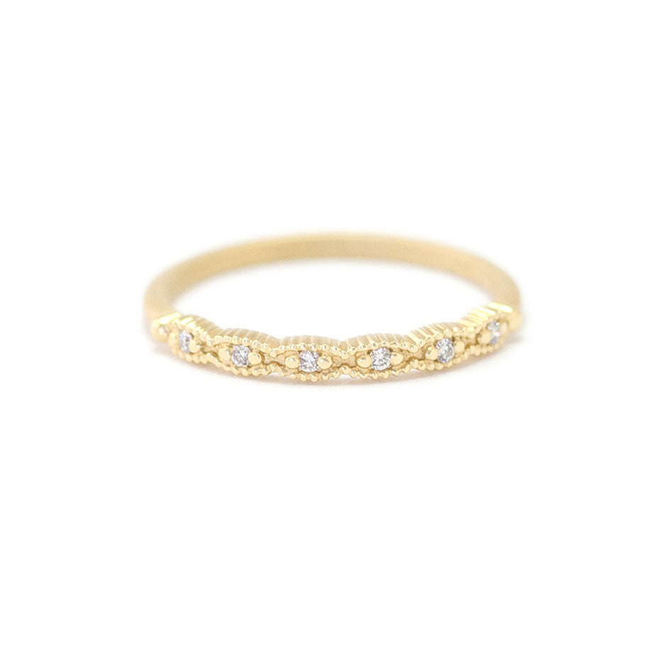 Handmade thin wedding band with scalloped ribbing in 18K yellow gold by Designer Megan Thorne