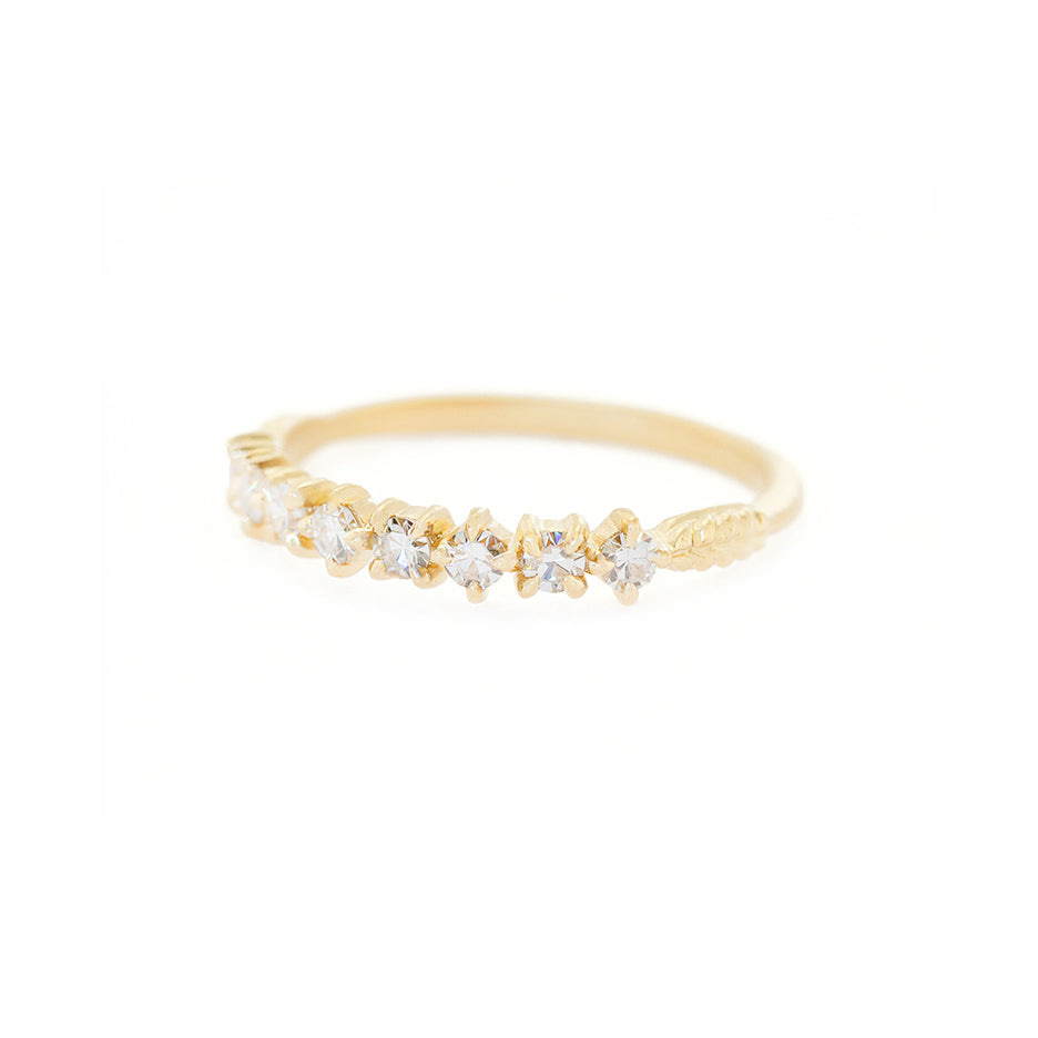 Handmade wedding or stacking band with single cut diamonds and Evergreen botanical details in 18K yellow gold by Designer Megan Thorne