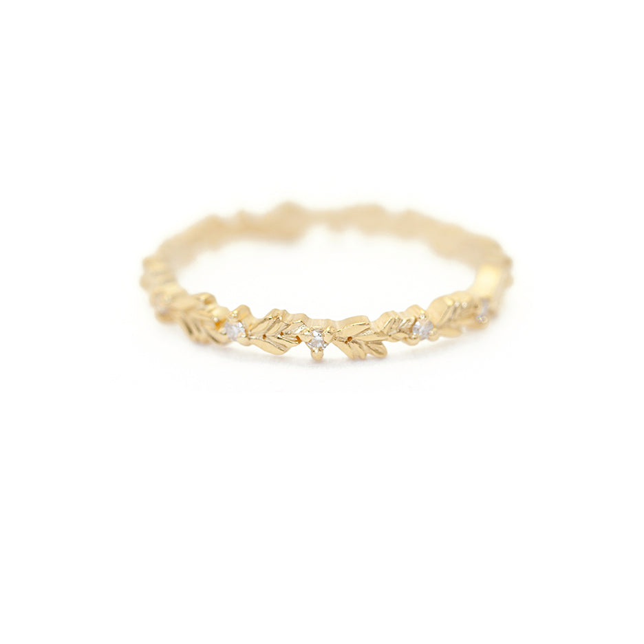 Handmade thin eternity wedding band or stacking ring featuring diamonds and hand carved floral Wood Nymph details in 18K yellow gold by Designer Megan Thorne