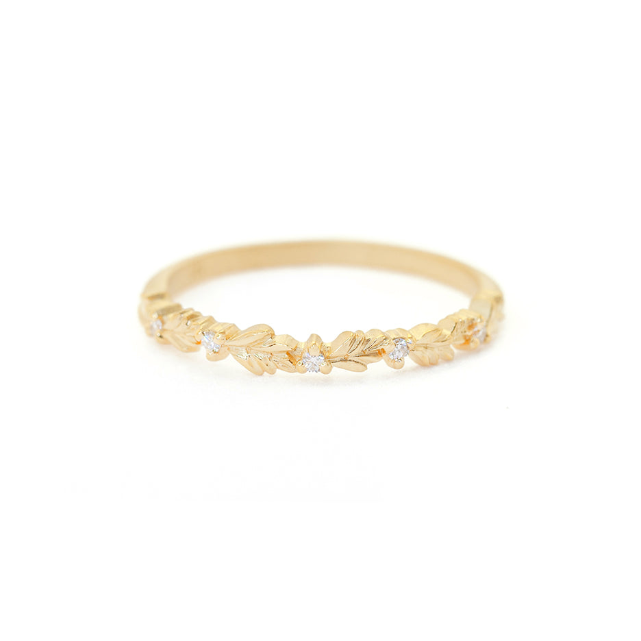 Handmade thin wedding band or stacking ring featuring diamonds and hand carved floral Wood Nymph details in 18K yellow gold by Designer Megan Thorne