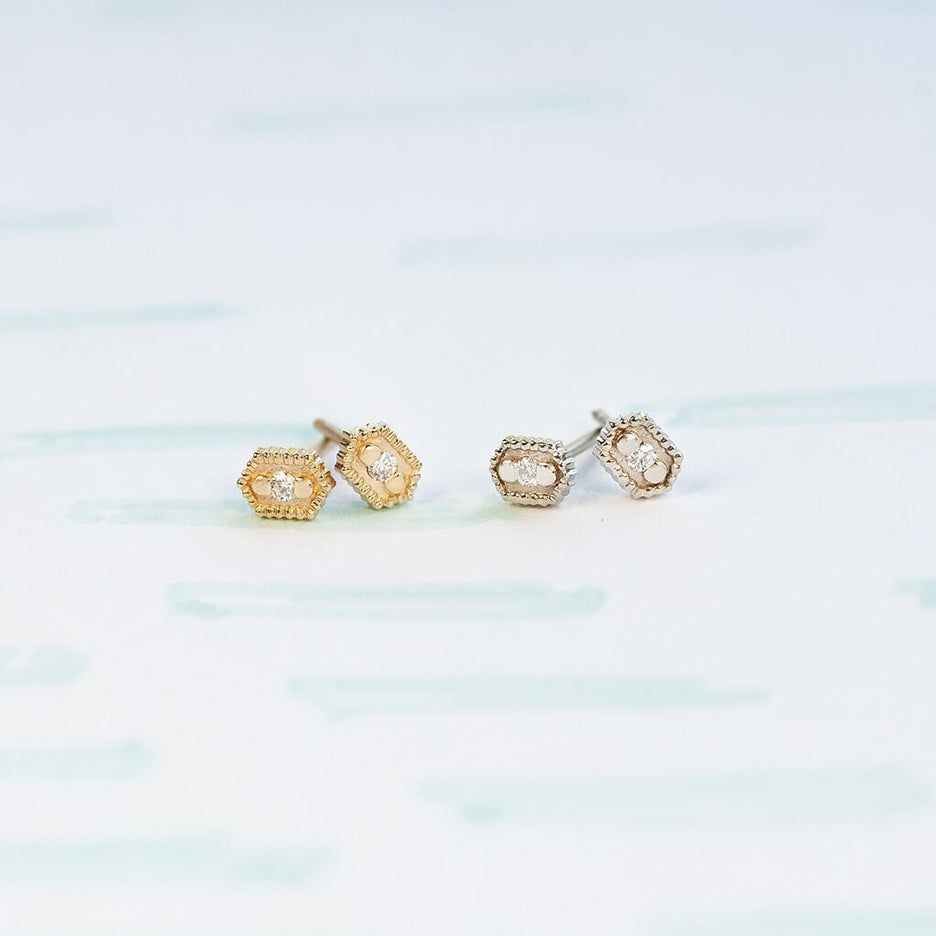 Handmade hexagon shaped stud earrings with ribbing, beading and diamonds in 18K yellow gold by Designer Megan Thorne