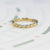Handmade vintage inspired wedding or stacking band with scalloped ribbing and bezel set diamonds in two tone 18K yellow and white gold by Designer Megan Thorne