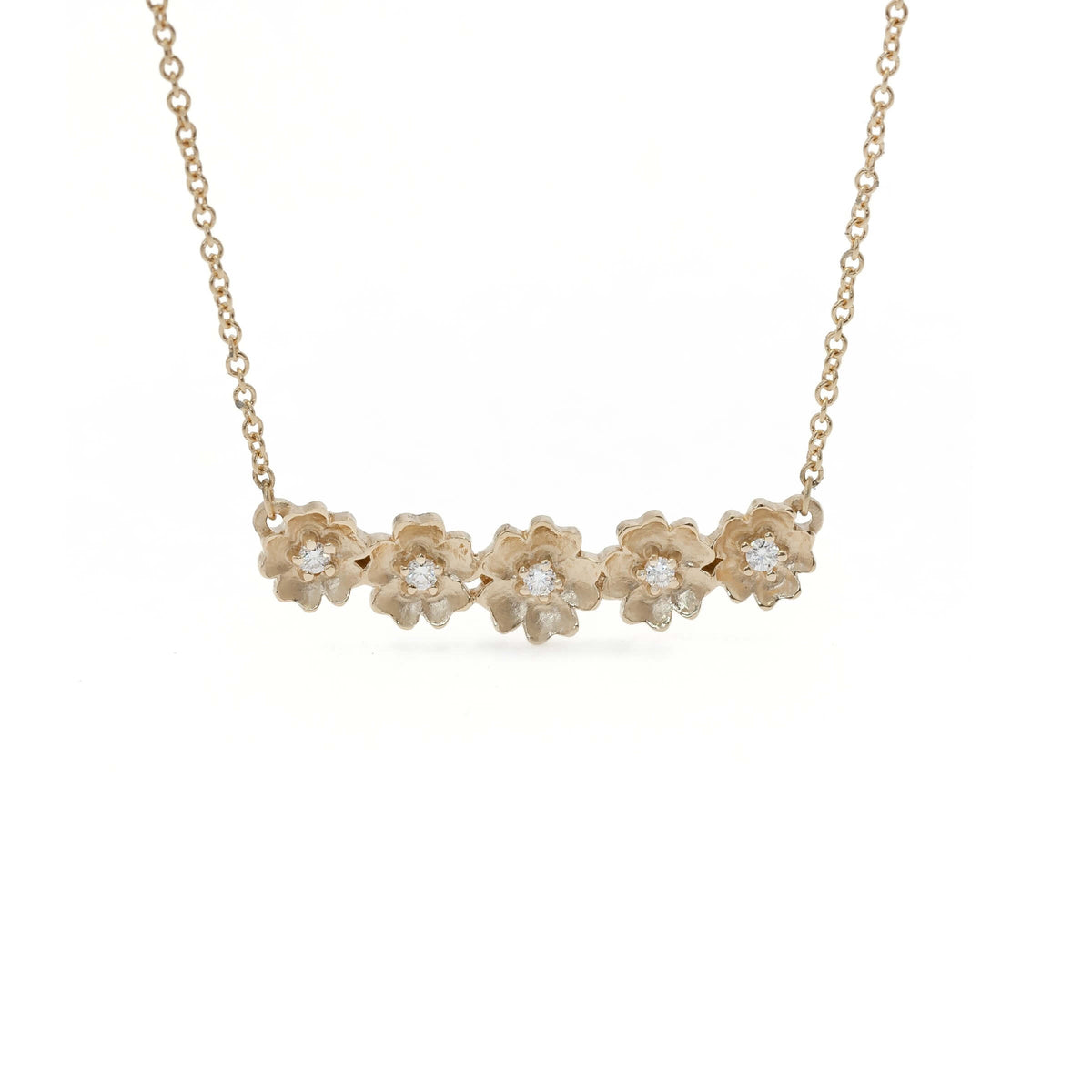 Handmade floral necklace with five Buttercup flowers with diamonds in 18K yellow gold by Designer Megan Thorne