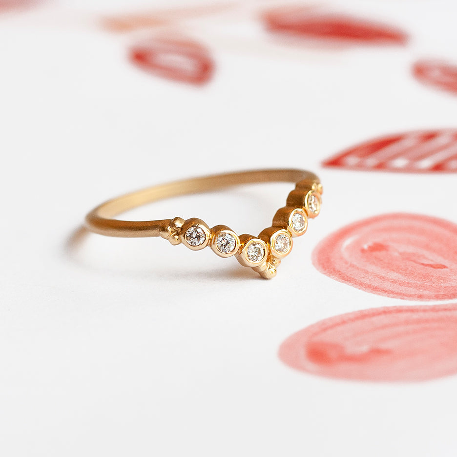 wedding V guard in yellow gold with bezel set diamonds angle 1