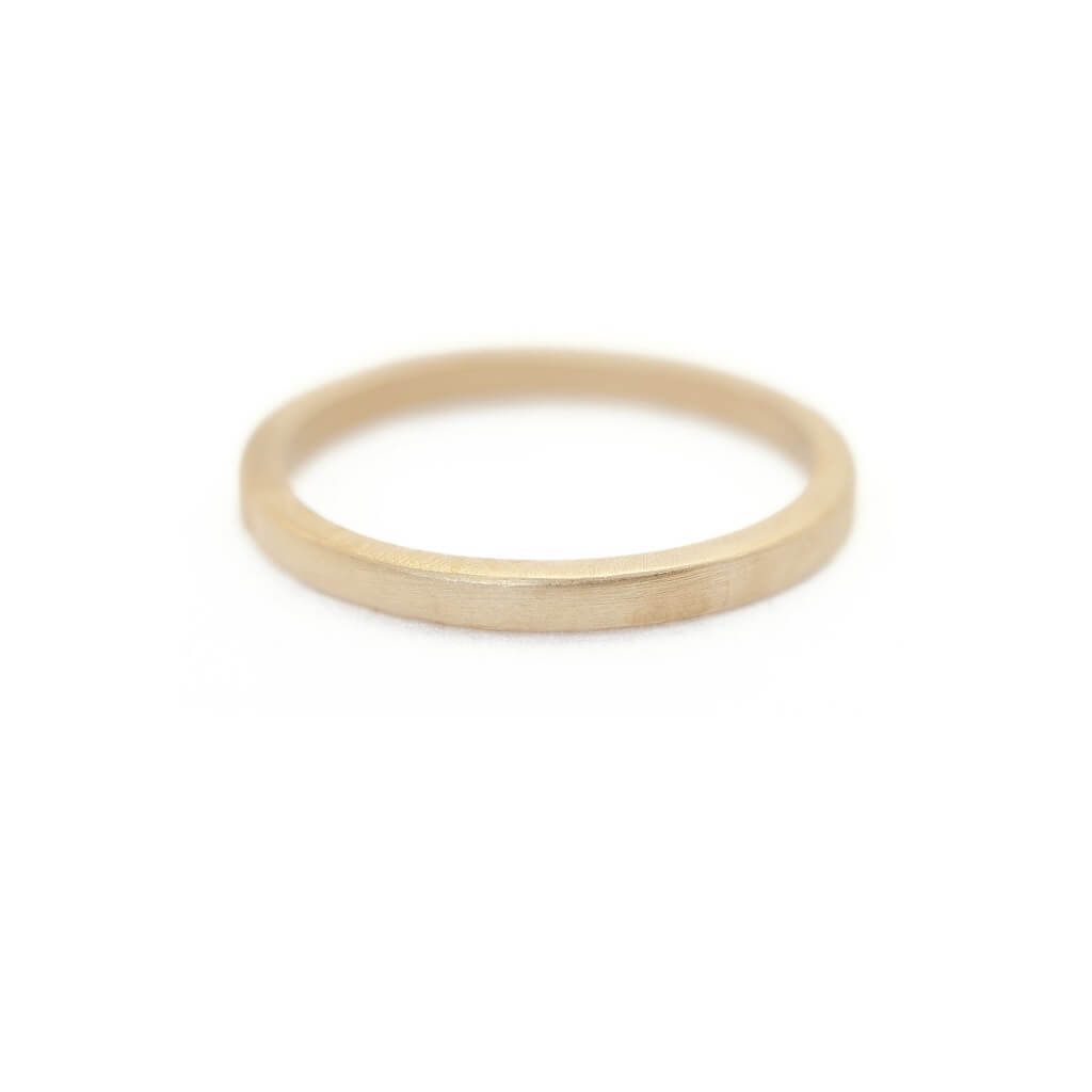 Handmade classic thin plain stacking or wedding band in 18K yellow gold by Designer Megan Thorne