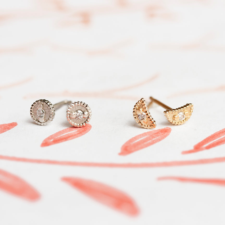 Handmade crescent shaped stud earrings with ribbing, beading and diamonds in 18K yellow gold by Designer Megan Thorne