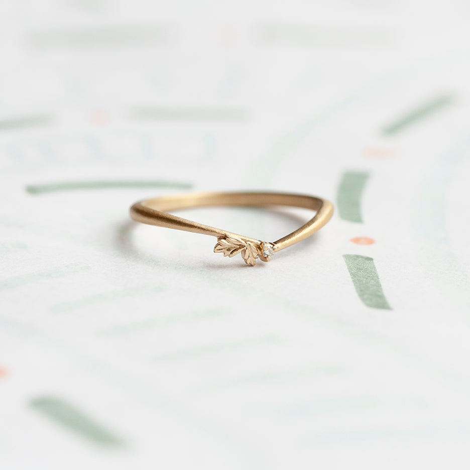 Handmade classic engagement ring guard can be used as wedding band with asymmetrical diamond accents and floral Wood Nymph details in 18K yellow gold by Designer Megan Thorne