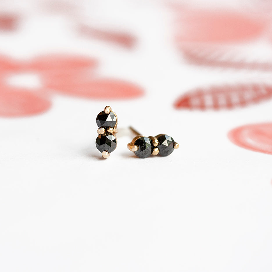 Handmade stud earrings with rose cut black diamonds and beading in 18K yellow gold by Designer Megan Thorne