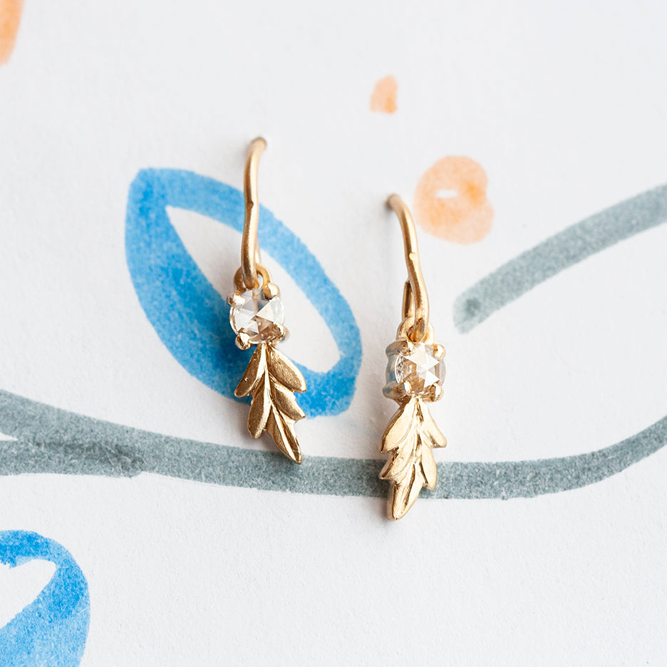 Handmade dangle drop earrings with rose cut diamonds and leafy Wood Nymph details in 18K yellow gold by Designer Megan Thorne  