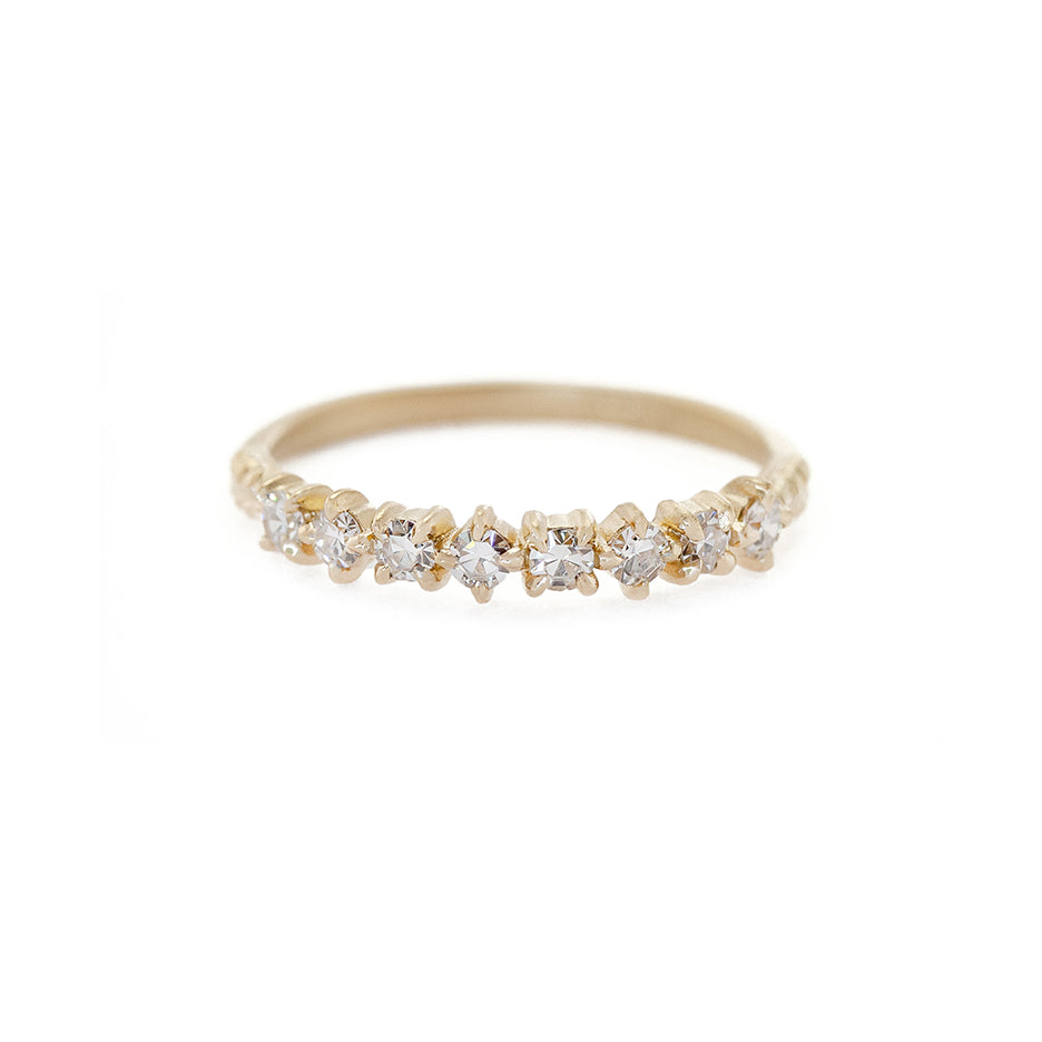 Handmade wedding or stacking band with single cut diamonds and Evergreen botanical details in 18K yellow gold by Designer Megan Thorne