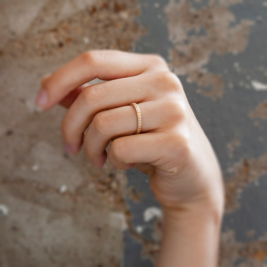 Handmade eternity wedding or stacking band with beading and ribbing in 18K yellow gold with diamonds by Designer Megan Thorne