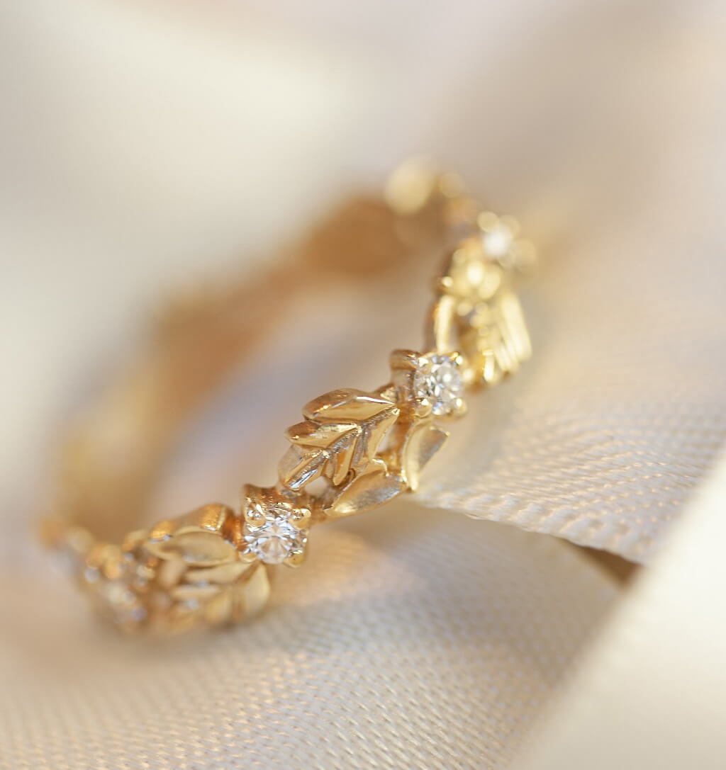 Handmade wide eternity wedding band or stacking ring with diamonds and hand carved floral Wood Nymph details in 18K yellow gold by Designer Megan Thorne