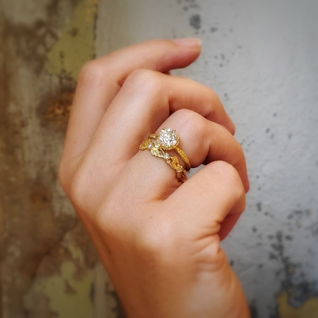Handmade wide eternity wedding band or stacking ring with diamonds and hand carved floral Wood Nymph details in 18K yellow gold by Designer Megan Thorne